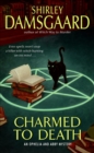 Image for Charmed to death: an Ophelia and Abby mystery