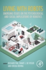 Image for Living with robots  : emerging issues on the psychological and social implications of robotics