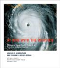 Image for At war with the weather  : managing large-scale risks in a new era of catastrophes