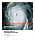 Image for At war with the weather  : managing large-scale risks in a new era of catastrophes