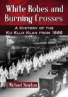 Image for White robes and burning crosses  : a history of the Ku Klux Klan from 1866