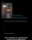 Image for Tourists in historic towns: urban conservation and heritage management