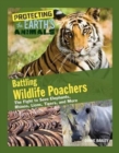 Image for Battling wildlife poachers  : the fight to save elephants, rhinos, lions, tigers, and more