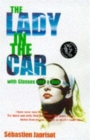 Image for The lady in the car with glasses and a gun