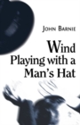 Image for Wind playing with a man&#39;s hat