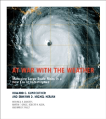 Image for At war with the weather: managing large-scale risks in a new era of catastrophes